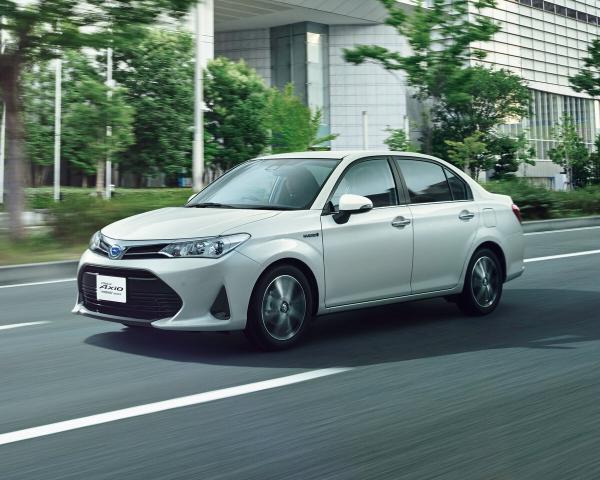 Фото Toyota Corolla XI (E160, E170) Рестайлинг 2 Седан Axio